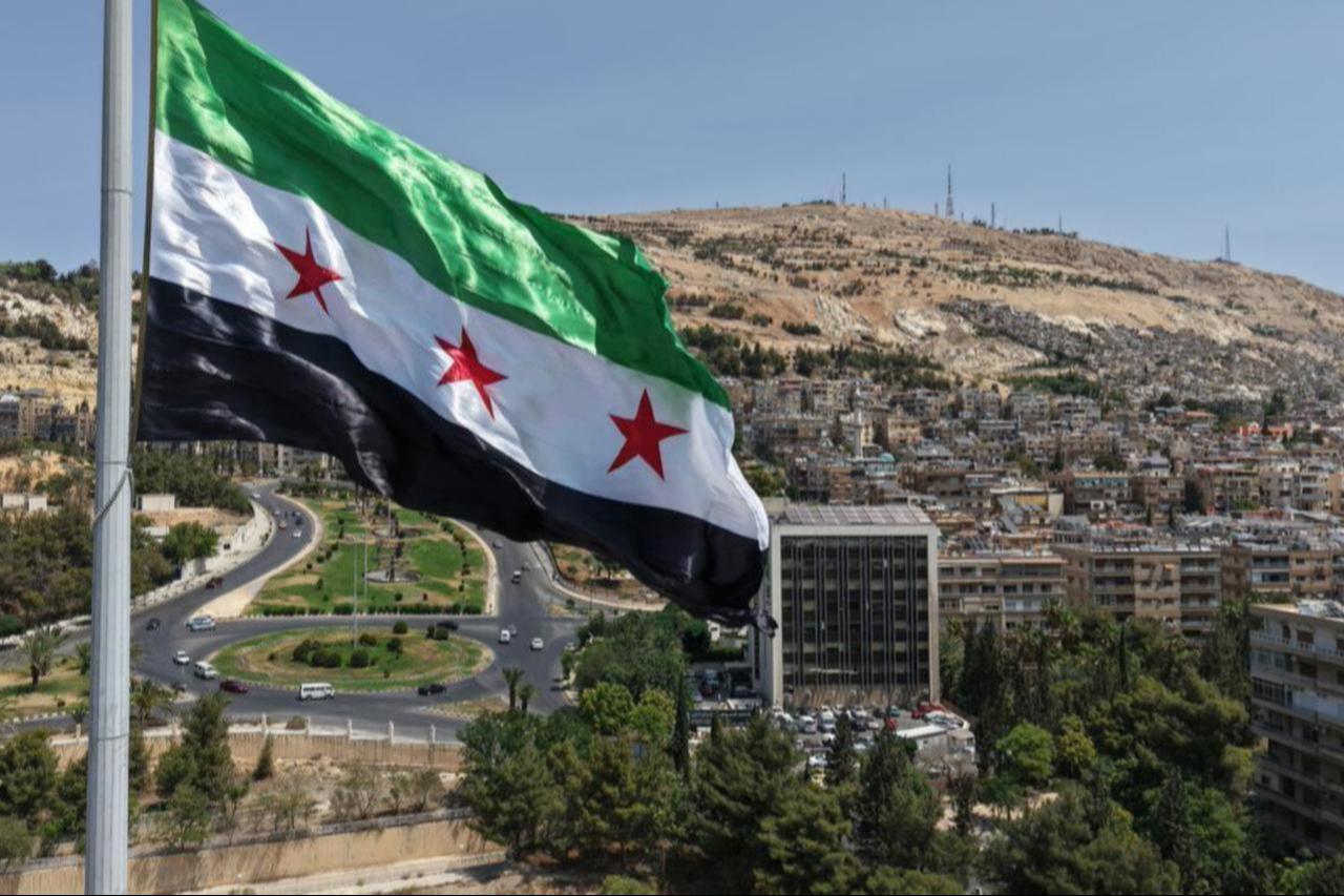 The largest Syrian flag of 600 square meters is hoisted on the tallest pole, 110 meters high, in Tishreen Park of the Syrian capital Damascus, June 4, 2025. (AA Photo)