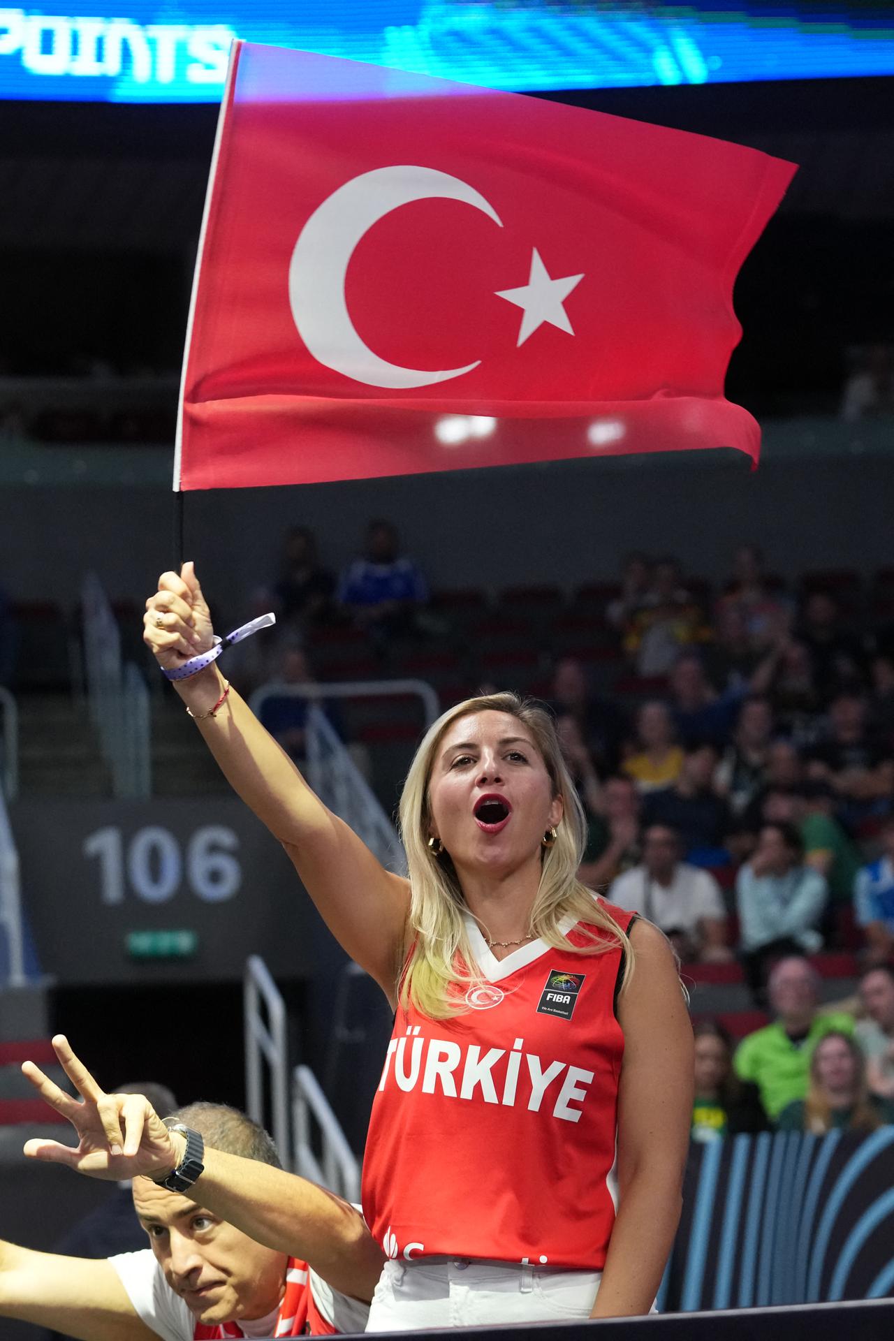 A fan of Türkiye waves a flag at the FIBA EuroBasket 2025 quarter-final basketball match between Türkiye and Poland in Riga, Latvia, September 9, 2025. (AFP Photo)