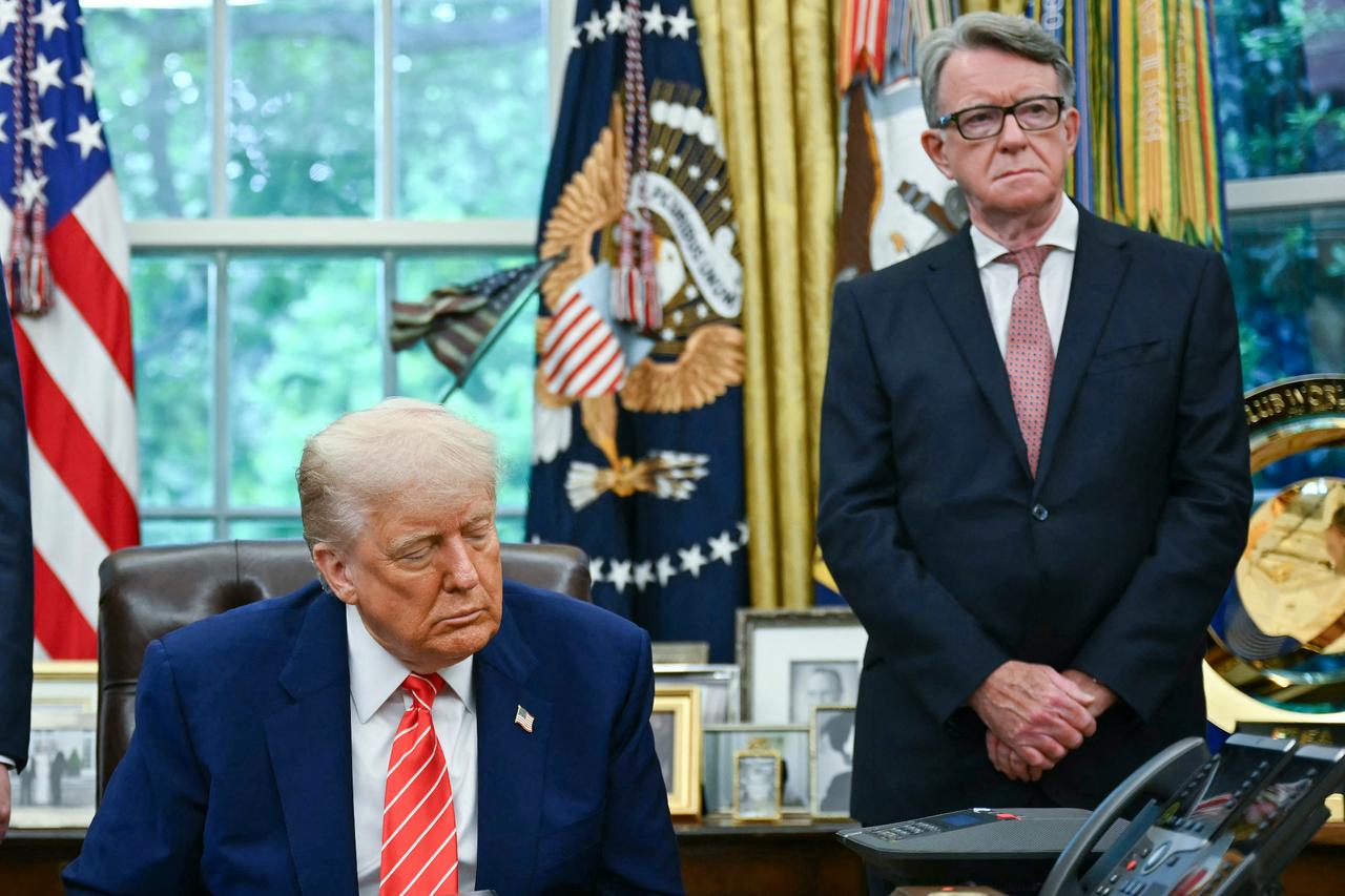 U.S. President Donald Trump makes a trade announcement as British ambassador to the United States Peter Mandelson looks on in the Oval Office of the White House in Washington, U.S. on May 8, 2025. (AFP Photo)