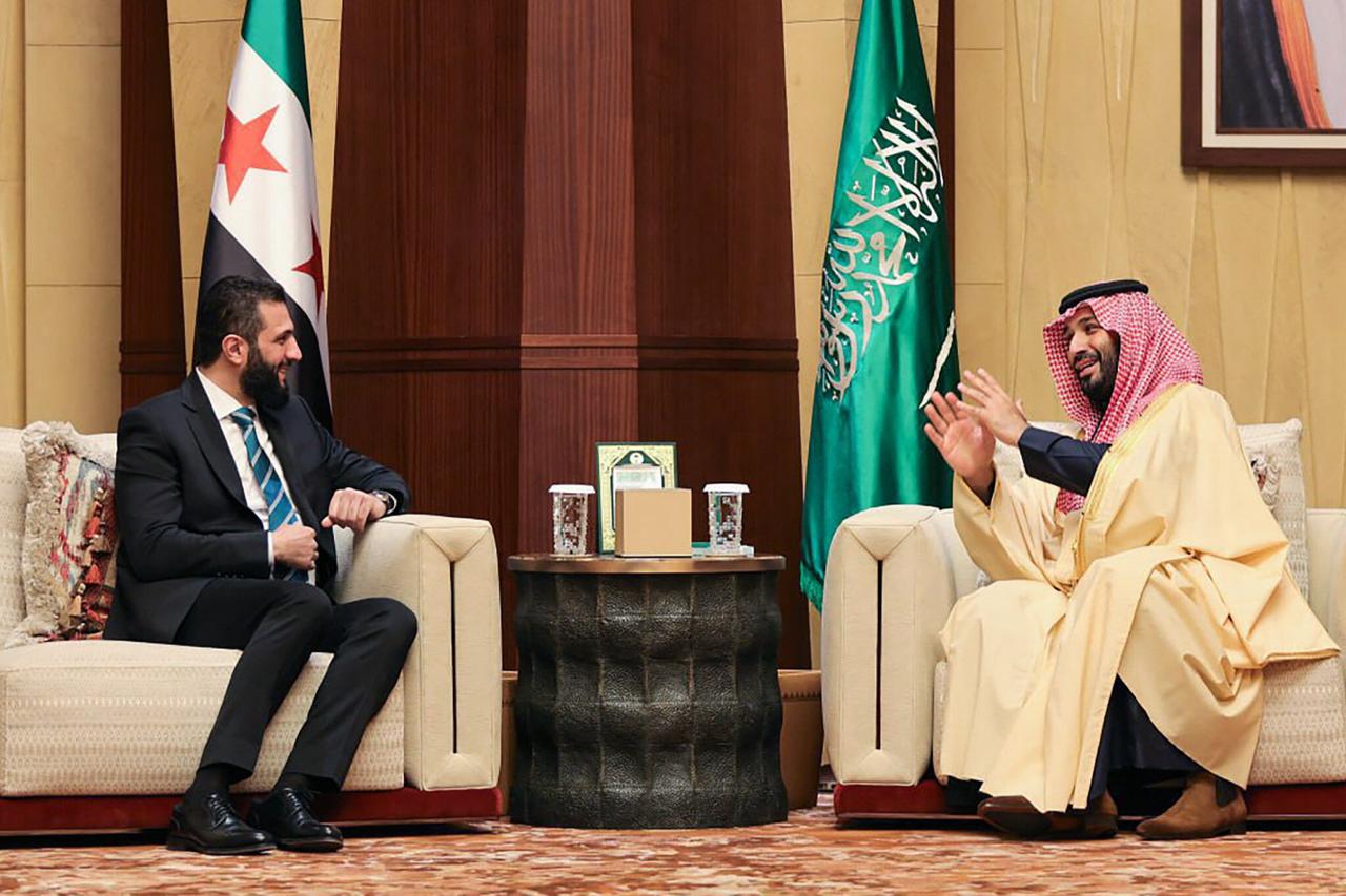 This handout picture provided by the media office of Syrias transitional government shows Saudi Arabias Crown Prince Mohammed bin Salman (R) during his meeting with Syrian interim president, Ahmed al-Sharaa, in Riyadh on February 2, 2025. (AFP Photo)