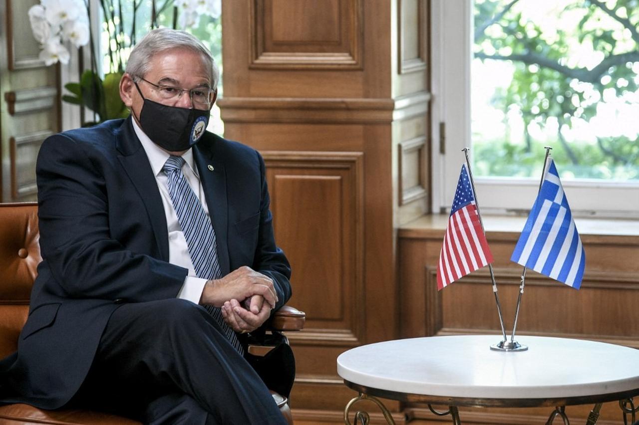 Anti-Türkiye former US senator Bob Menendez sitting next to flags of Greece and the US, accessed on Sep. 11, 2025. (AFP Photo)
