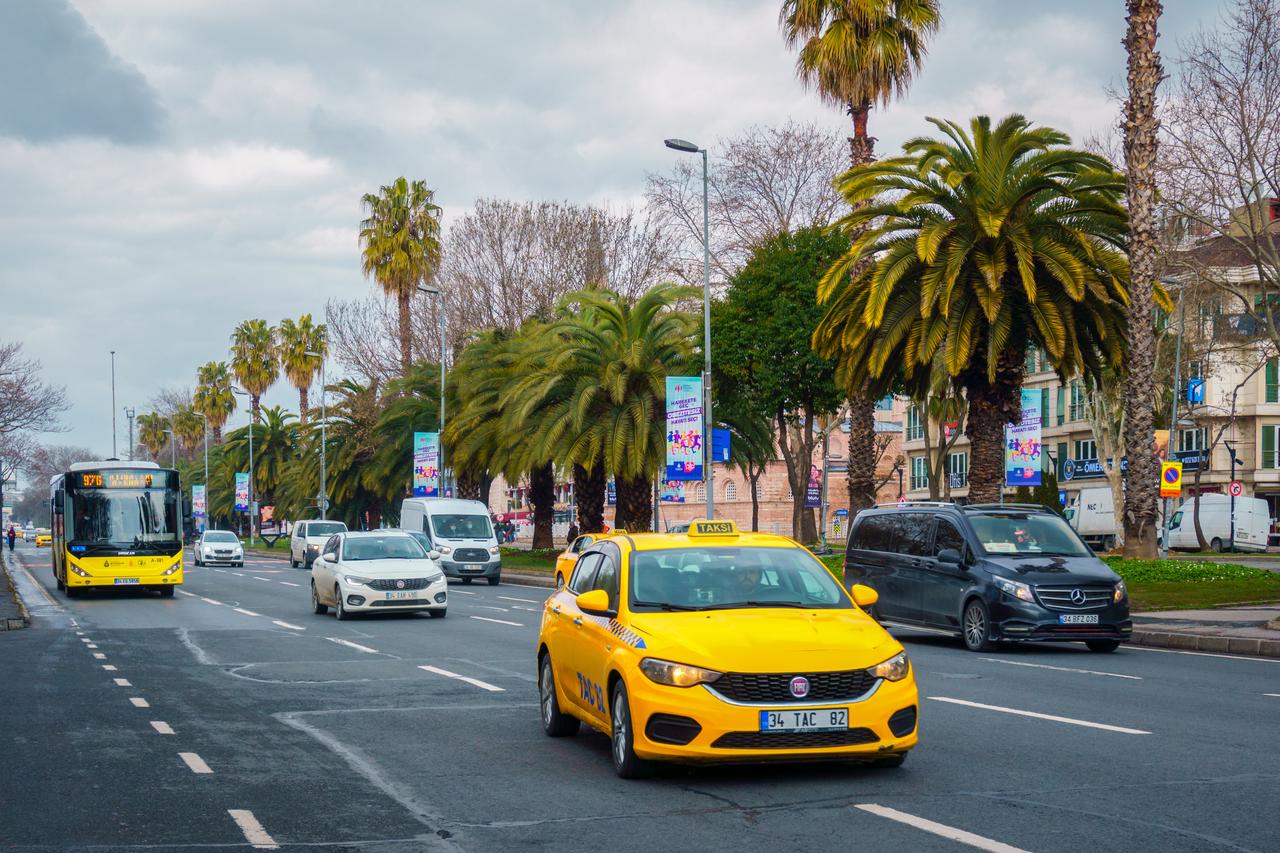 A taxi and public bus drive along a boulevard in Istanbul, Türkiye, March 15, 2022. (Adobe Stock Photo)