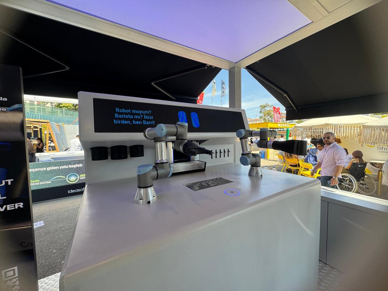 A robot barista named “X BARISTA” serves coffee to visitors at the Istanbul Coffee Festival in Kadikoy, Istanbul, Türkiye, Sept. 11, 2025. (AA Photo)