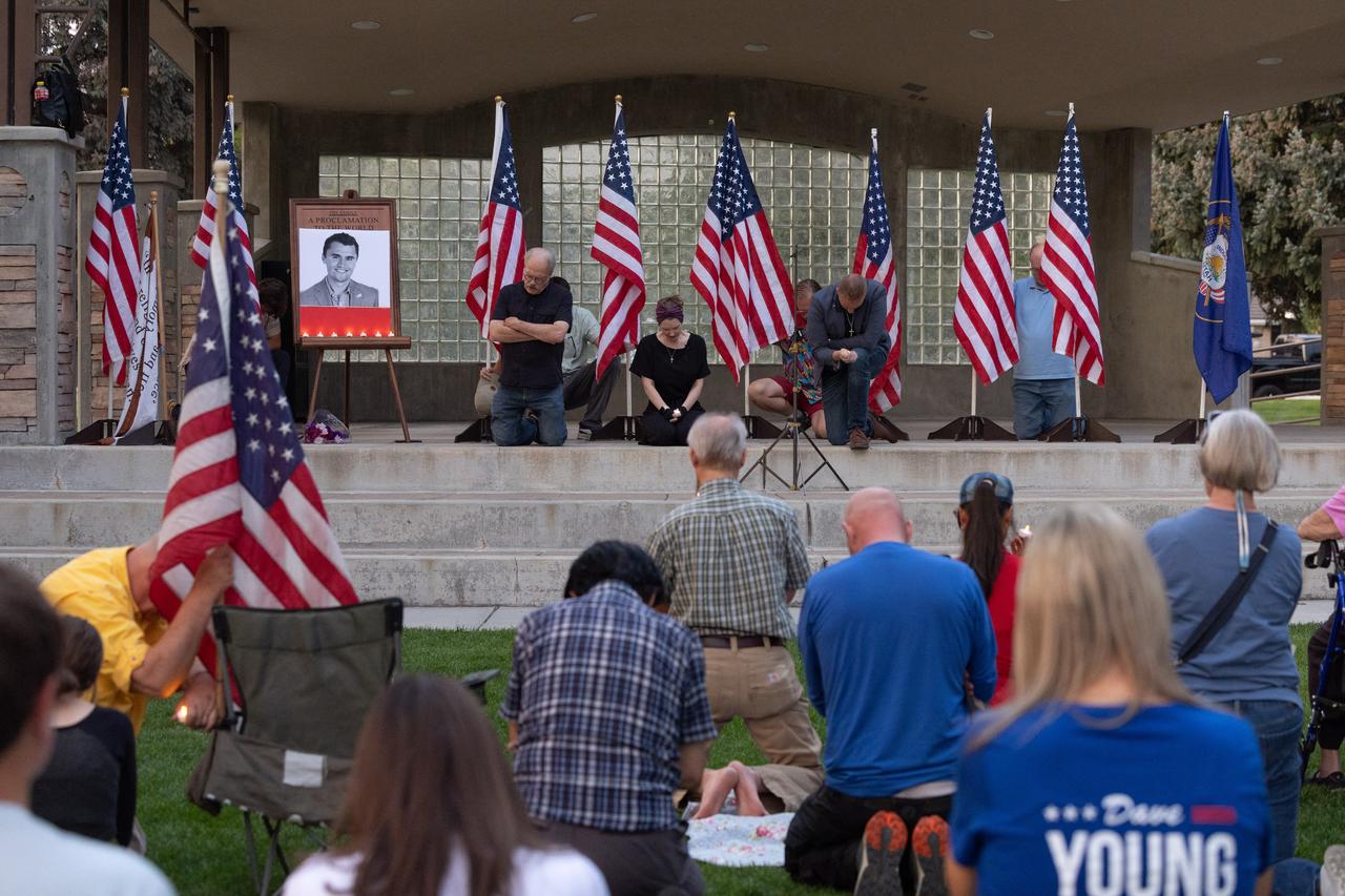 People pray as they attend a vigil for youth activist and influencer Charlie Kirk, who was shot at a public event at Utah Valley University, in Orem City Center Park, Orem, Utah, on September 10, 2025. (AFP Photo)