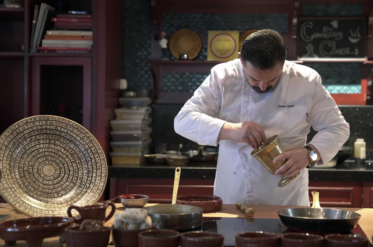 Chef Osman prepares an 11-course menu inspired by archaeological research in Istanbul, Türkiye, July 29, 2025. (AA Photo)