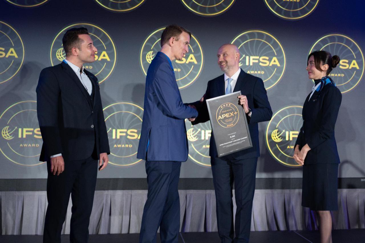 AJet Deputy General Manager Cemal Kaya (right) shakes hands with APEX/IFSA CEO Joe Leader (second from left) after receiving the "Four-Star Low-Cost Carrier" award at the APEX/IFSA Global Expo in Los Angeles, September 12, 2025. (Courtesy of AJet)