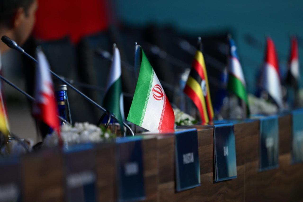 An Iranian flag with a general view of the 51st Meeting of the Council of Foreign Ministers of the Organization of Islamic Cooperation (OIC) in Istanbul, Türkiye, June 21, 2025. (AA Photo)