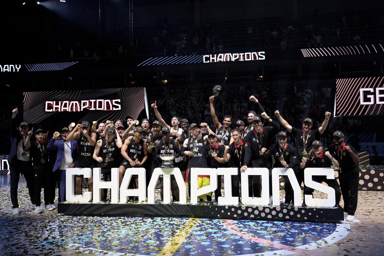 Players of Germany celebrate after winning the 2025 European Basketball Championship (EuroBasket 2025) final match between Türkiye and Germany at the Arena Riga in Riga, Latvia on Sep. 14, 2025. (AA Photo)