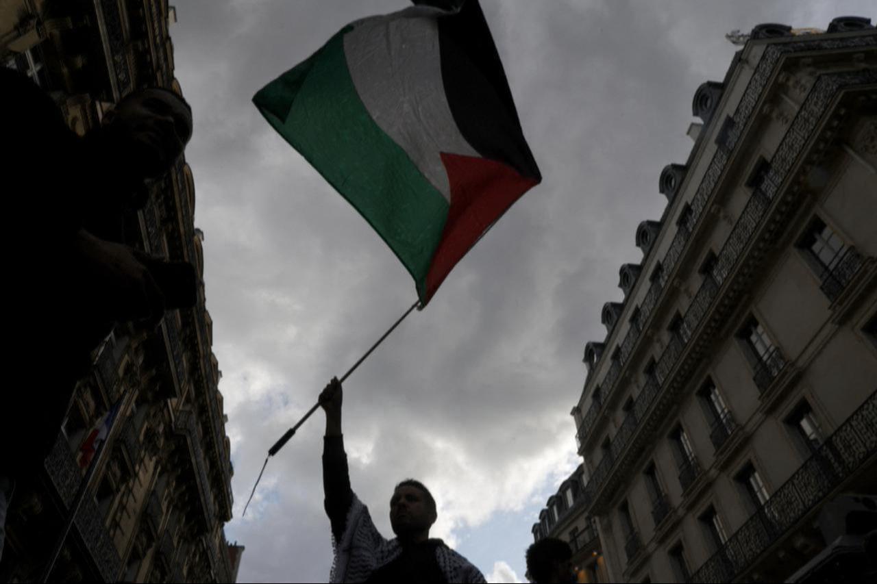 A protestor holds up a Palestinian flag during a demonstration called by French organisation  France Palestine Solidarite  in Paris, France, May 27, 2024. (AFP Photo)