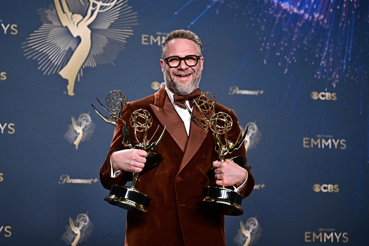 Seth Rogen poses with his Emmys for Outstanding Writing, Directing, Lead Actor, and Comedy Series for The Studio at the 77th Primetime Emmy Awards in Los Angeles, September 14, 2025. (Photo by Frederic J. Brown / AFP)