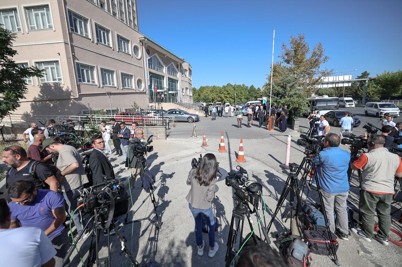Journalists wait outside the court in Ankara, where a hearing on corruption charges could potentially upend the leadership of Türkiye's main opposition party, the CHP, Sept. 15, 2025. (AFP Photo)