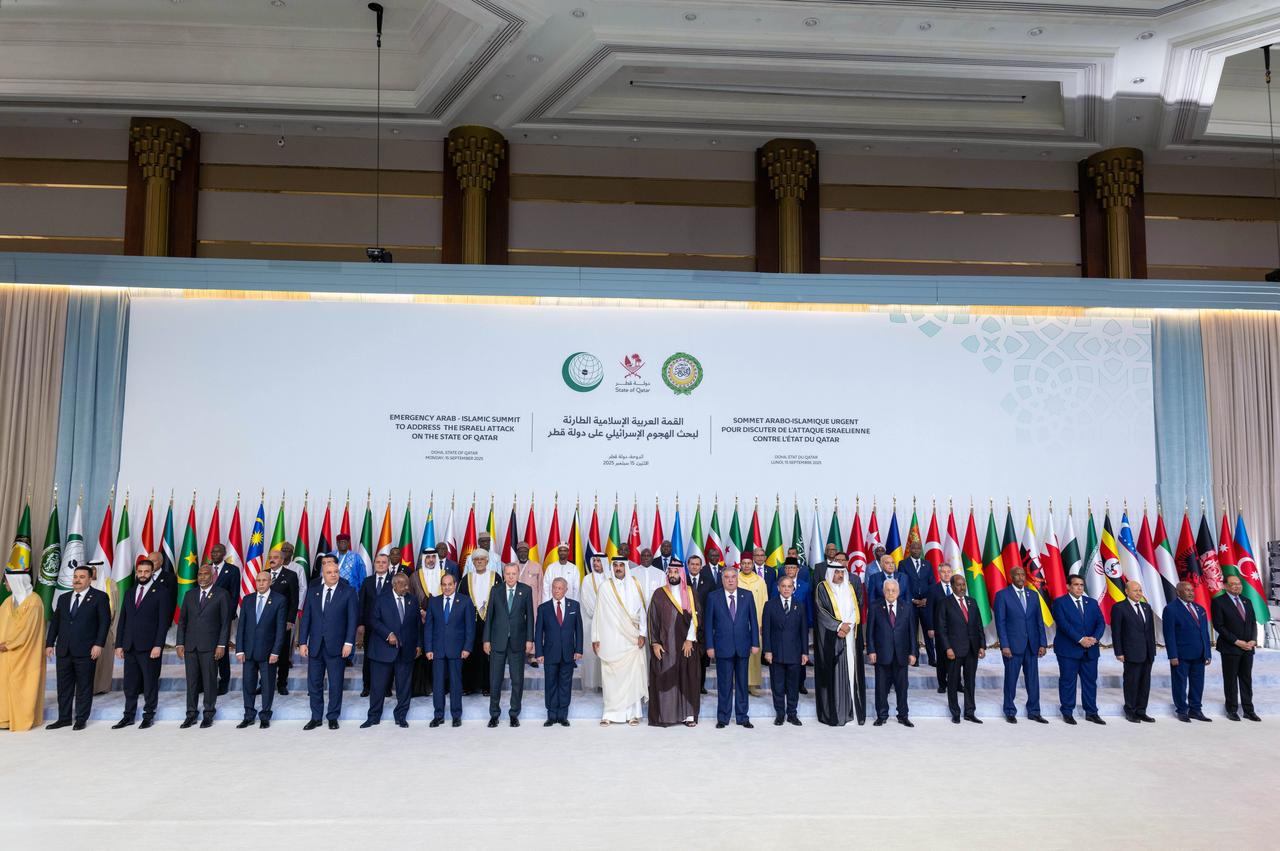 Turkish President Recep Tayyip Erdogan (front-9th L) joins the group photo during the Organization of Islamic Cooperation - Arab League Extraordinary Summit in Doha, Qatar on Sept. 15, 2025. (AA Photo)