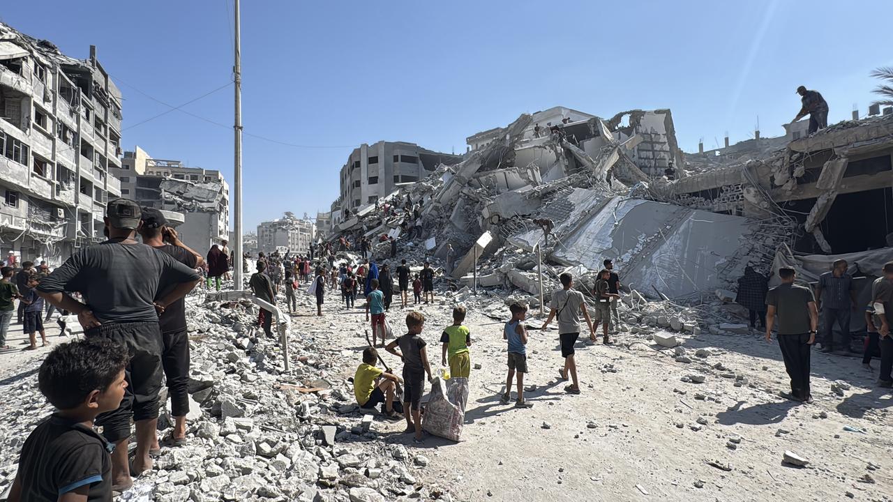 Palestinians inspect the scale of destruction after al-Ghafri Tower is completely destroyed as a result of the Israeli attacks on Gaza City, Gaza on September 15, 2025. (AA Photo)