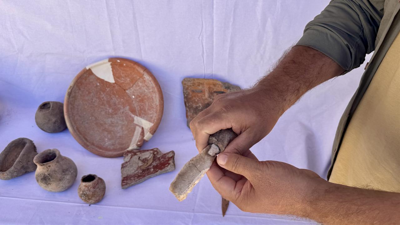 Various artifacts, including stone axes and pottery fragments, uncovered during excavations at Gokhoyuk in Konya, Türkiye, Sept. 16, 2025. (AA Photo)