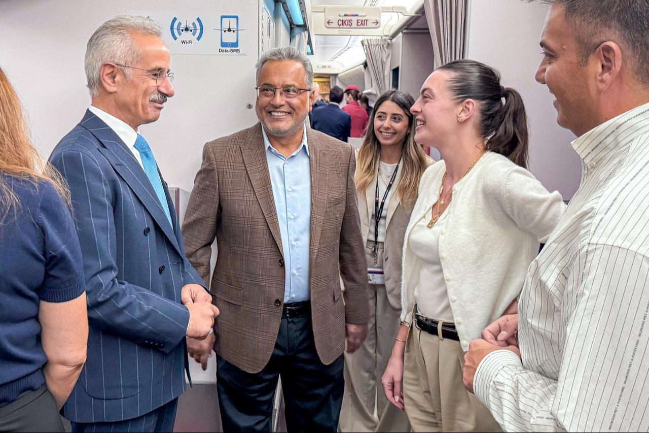 Türkiye’s Transport and Infrastructure Minister Abdulkadir Uraloglu (L) and Turkish Airlines Chairman Ahmet Bolat (2nd L) attend the inaugural Istanbul–Seville flight, September 17, 2025. (AA Photo)
