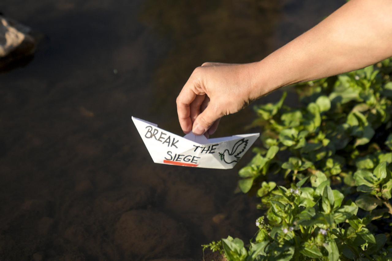 Bosnians float paper boats on Miljacka River to show solidarity with Global Sumud Flotilla that set sail to break the Israeli blockade on Gaza, Sarajevo, Bosnia and Herzegovina, Sep. 4, 2025. (AA Photo)