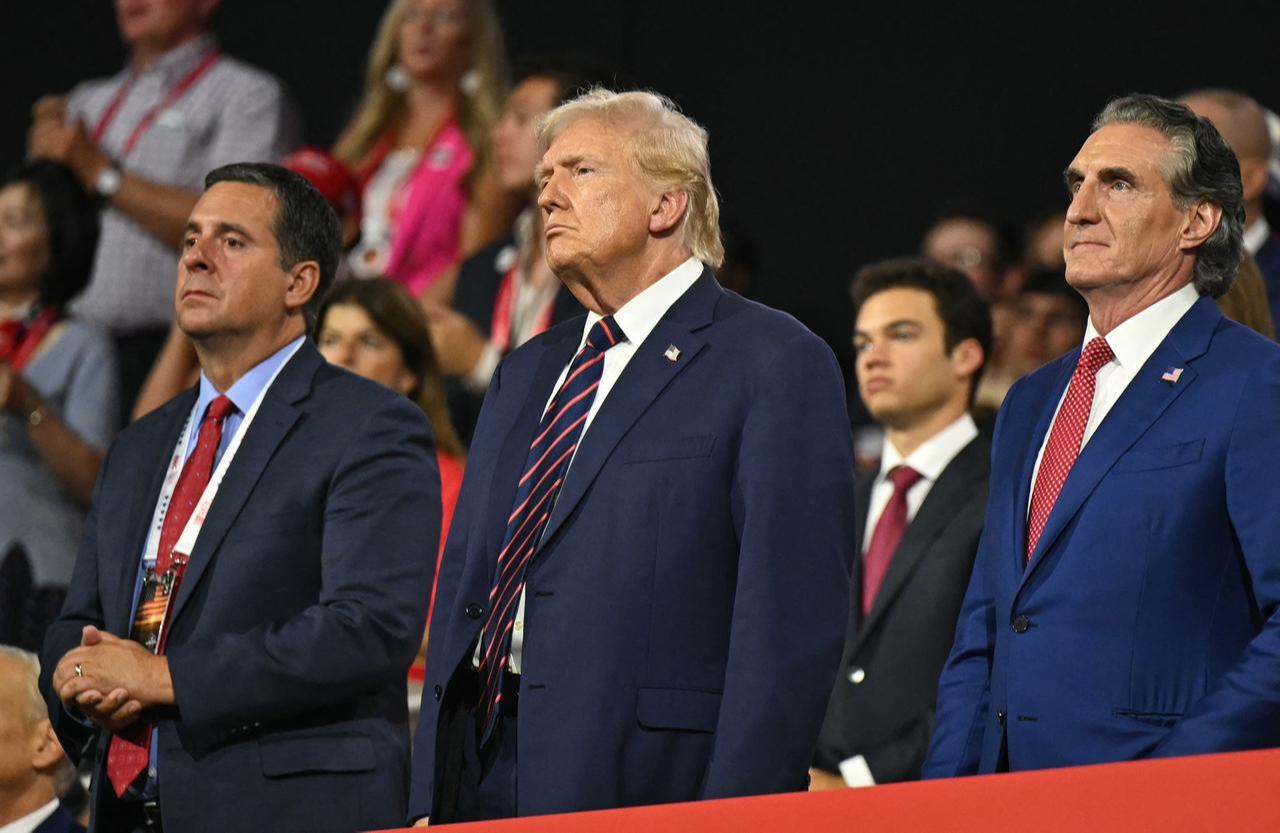 U.S. Rep. Devin Nunes (L), US former President and 2024 Republican presidential candidate Donald Trump (C) and North Dakota Governor Doug Burgum (R) during the third day of the 2024 Republican National Convention at the Fiserv Forum in Milwaukee, Wisconsin, U.S, on Jul. 17, 2024. (AFP Photo)