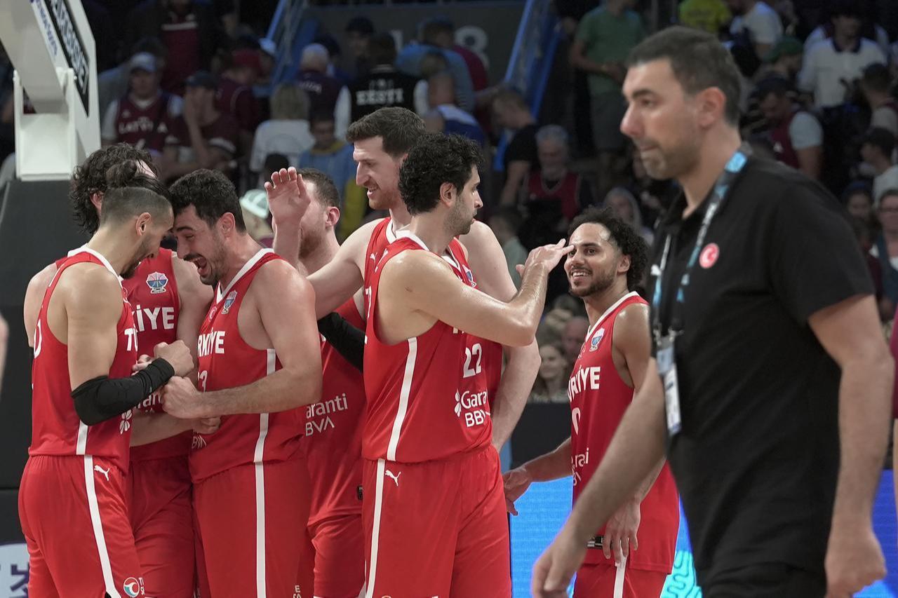 Players of Türkiye celebrate victory at the end of the FIBA EuroBasket 2025 Group A 1st week match between Latvia and Türkiye, Riga, Latvia, August 27, 2025. (AA Photo)
