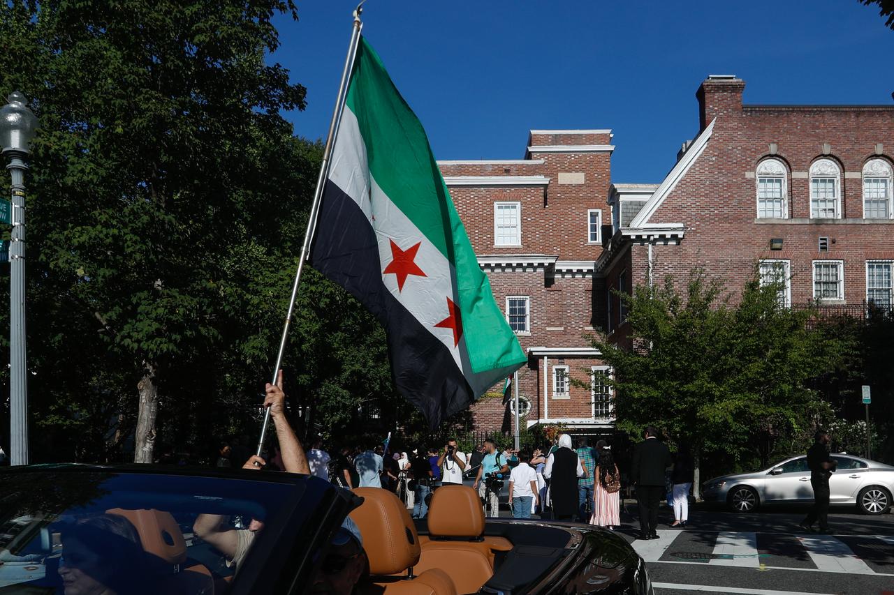 Syrian Foreign Minister Assad Hassan al-Shaybani attends the ceremony held at the Syrian Embassy and raises the Syrian flag in Washington, D.C., United States, September 19, 2025. (AA Photo)
