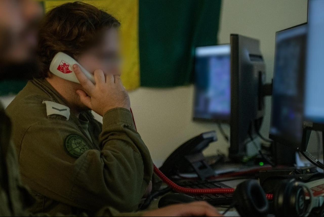 Soldiers of an Israeli army Military Intelligence Directorate team for the Golani Infantry Brigade are seen working at computers, in a handout photo published November 12, 2023. (Photo via Israeli army)