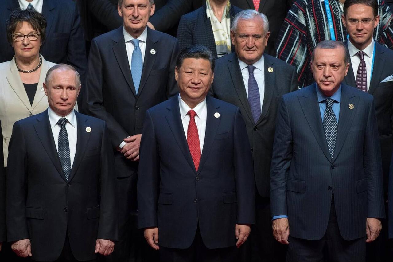 Chinese President Xi Jinping (C), Russian President Vladimir Putin (L), and President Recep Tayyip Erdogan (R), stand together for group photo during Belt and Road Forum for International Cooperation on May 15, 2017, in Beijing, China. (Photo via Kremlin)