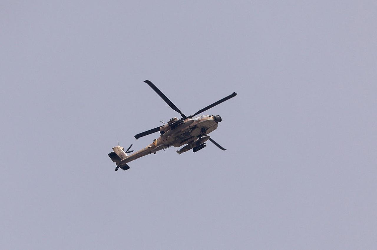 An Israeli military AH-64 Apache attack helicopter flying over the Gaza Strip during Israeli bombardment on May 17, 2025. (AFP Photo)