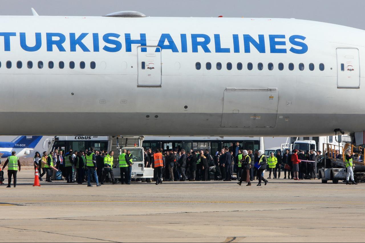 Passengers disembark from a Turkish Airlines aircraft carrying a diplomatic delegation from Ankara and an aid shipment provided by the Turkish Red Crescent, at Damascus International Airport in Damascus, Syria, Jan. 23, 2025. (AFP Photo)