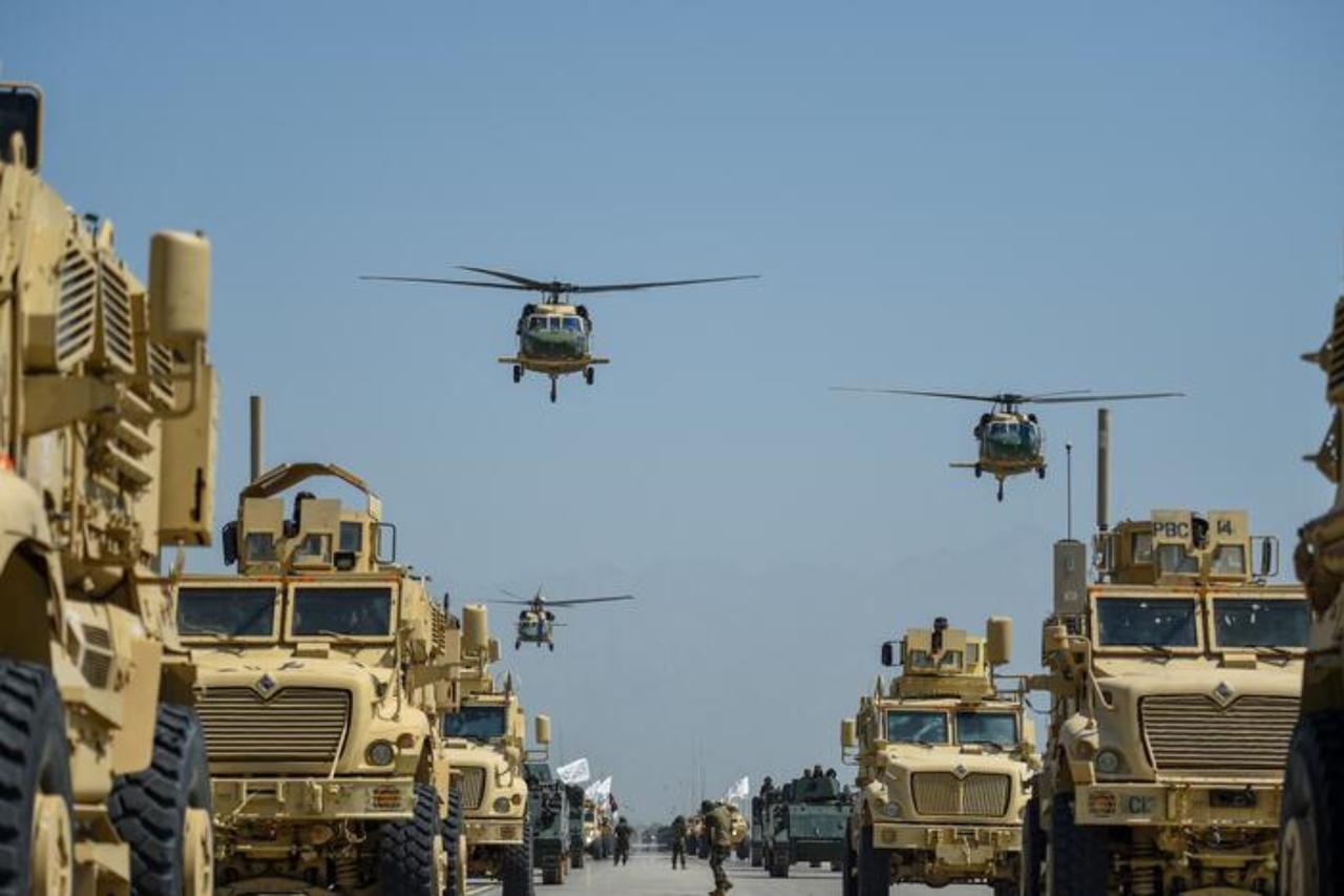 Taliban military helicopters fly to celebrate the 3rd anniversary of Talibans takeover of Afghanistan, at  Bagram Air Base, Bagram, Parwan province, August 14, 2024. (AFP Photo)