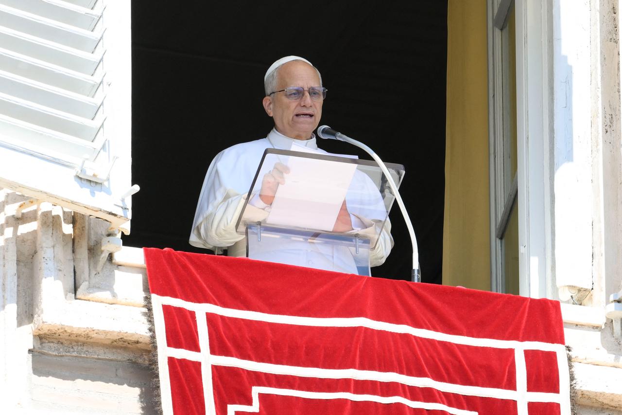 Pope Leo XIV addressing crowd from window of the apostolic palace overlooking St. Peters square during the Angelus prayer in The Vatican, Sept. 21, 2025. (Photo by Vatican Media/AFP)