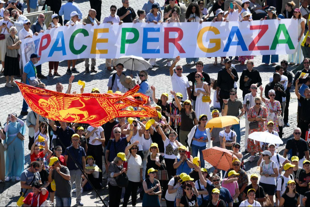 People holding a banner reading "Peace for Gaza" during Pope Leo XIV Angelus prayer at St Peter's quare in The Vatican, Sept. 21, 2025. (Photo by Vatican Media/AFP)
