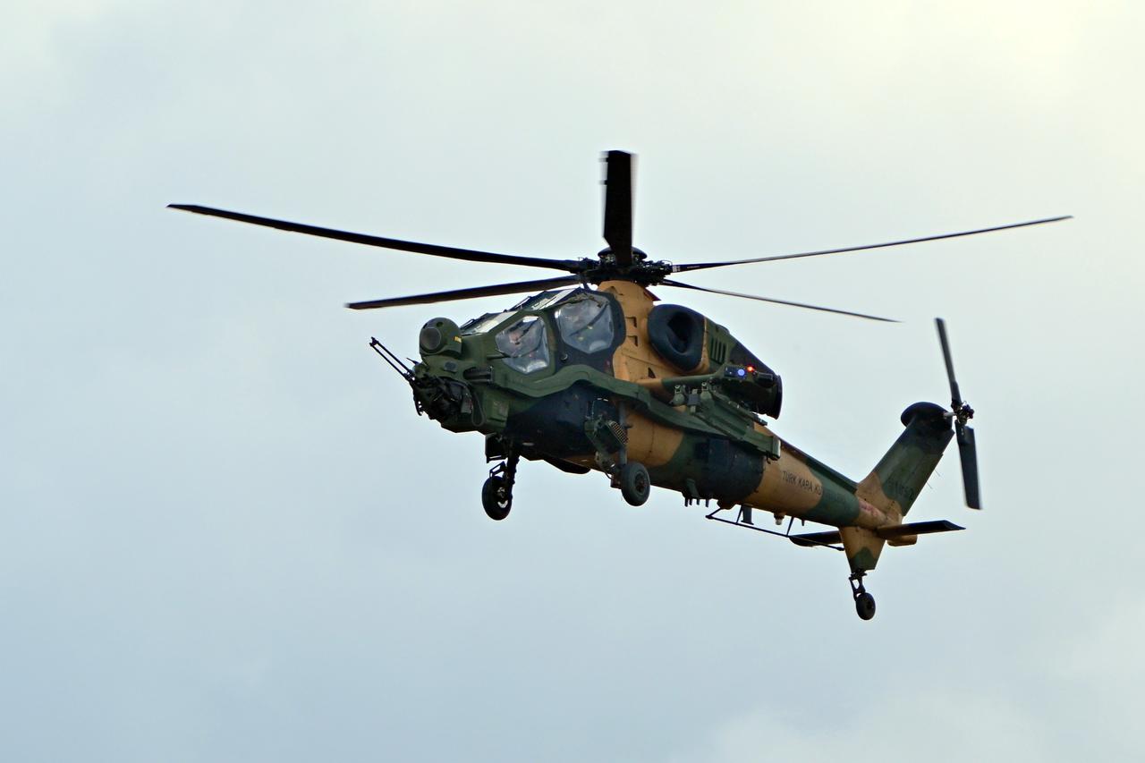 T-129 Attack and Tactical Reconnaissance helicopter performs a demonstration flight during Teknofest in Istanbul, Türkiye, Sept. 18, 2025. (AA Photo)