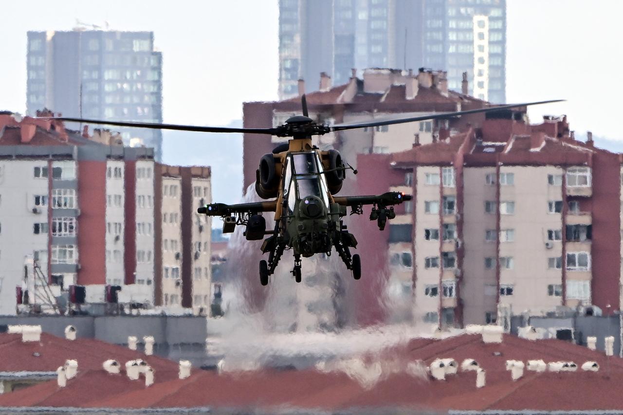 T-129 Attack and Tactical Reconnaissance helicopter performs a demonstration flight during Teknofest in Istanbul, Türkiye,  Sept. 18, 2025. (AA Photo)