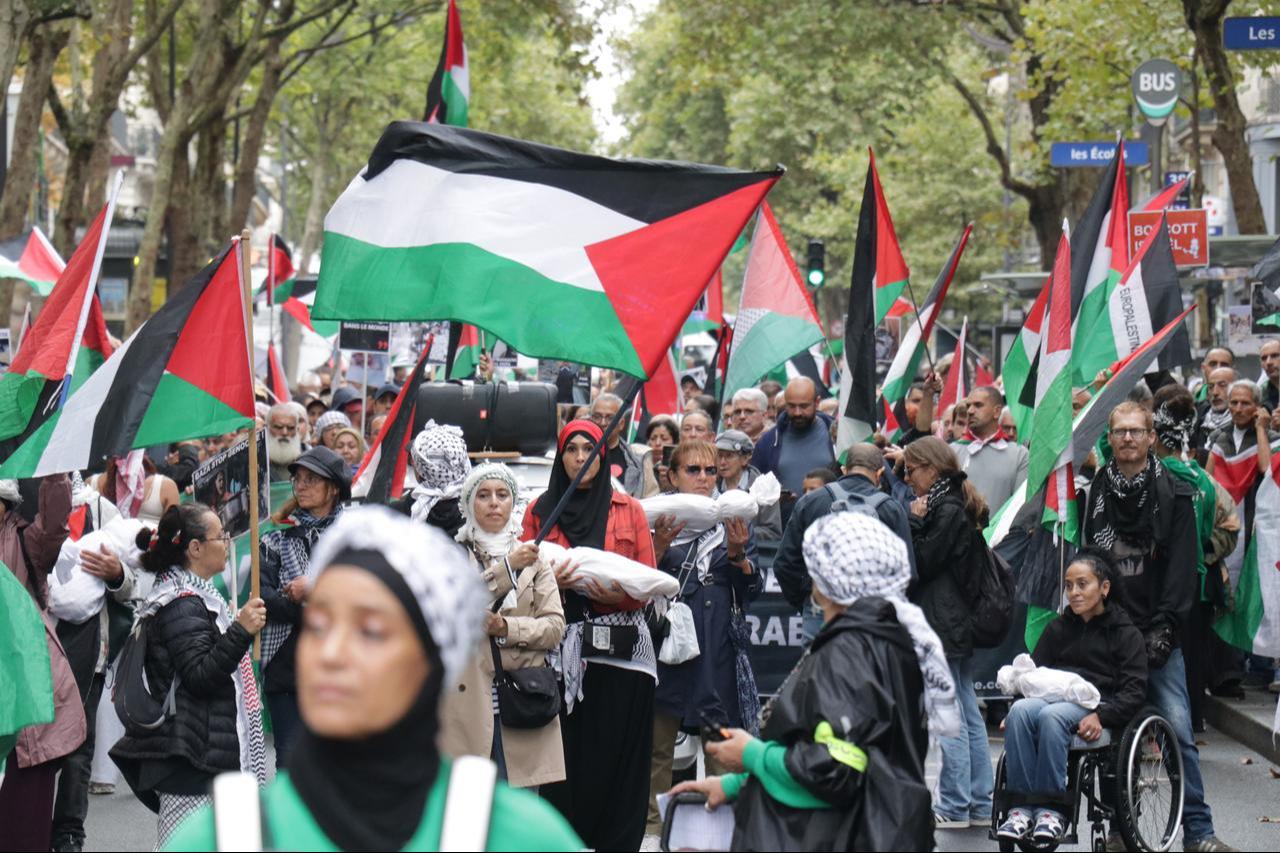 Protesters march with Palestinian flags and banners denouncing Israeli attacks over Gaza during a demonstration in Paris, September 20, 2025. (AA Photo)