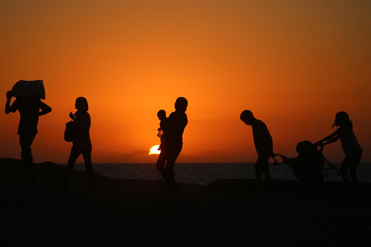 Displaced Palestinians move with their belongings southwards on a road in the Nuseirat refugee camp area in the central Gaza Strip, Sept. 20, 2025. (AFP Photo)