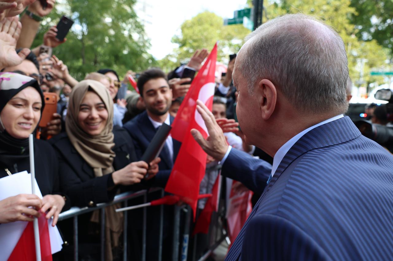 President Erdogan greets public at the entrance of Turkevi, where he arrived to attend the 80th session of UNGA in New York City US, Sept. 21, 2025. (Photo via Turkish Presidency/Murat Kula)