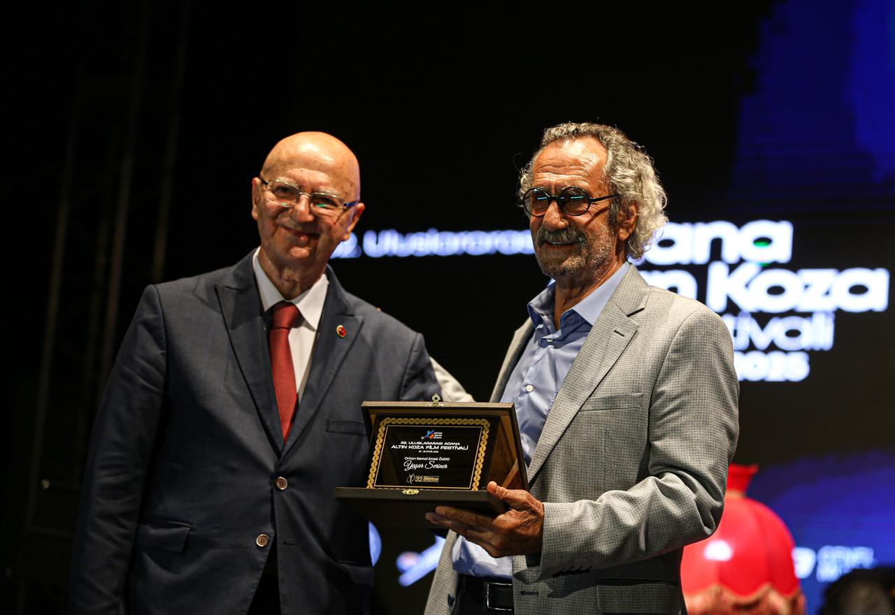 Director Yasar Seriner’s award is received on his behalf during the opening ceremony of the 32nd International Adana Golden Boll Film Festival, Sept. 22, 2025. (AA Photo)