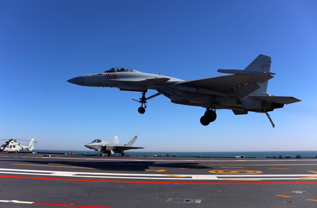 A J-15T fighter jet is landing on China's Fujian aircraft carrier at an undated time and location. (Photo via PLAN)