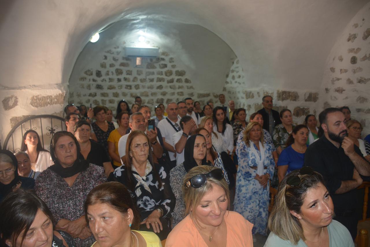 Assyrian diaspora members gather inside a village church in Sirnak’s Silopi district to hold prayers and remember their ancestors, Sept. 23, 2025. (AA Photo)