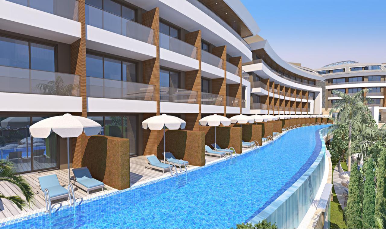 A rendering shows the swim-up rooms and poolside terraces of TUI Blue Maviss, a 499-room family-oriented resort scheduled to open in April 2026 in Antalya, Türkiye. (Photo via tuigroup.com)