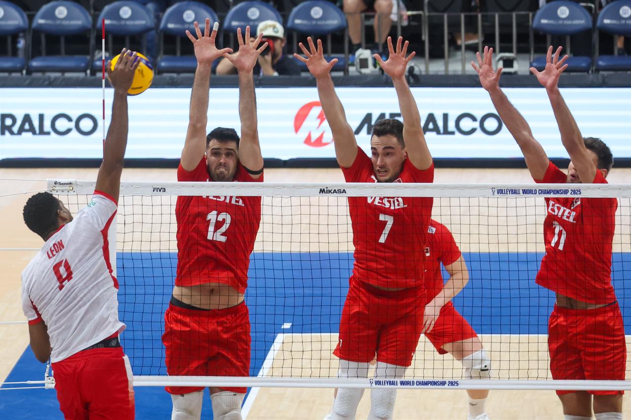 Leon of Poland in action against Adis Lagumdzija (L), Bedirhan Bulbul and  Mirza Lagumdzija of Türkiye during quarter finals between Türkiye and Poland, in the FIVB Volleyball Men's World Championship, at the Mall of Asia Arena, in Pasay City, Metro Manila, Philippines, September 24, 2025. (AA Photo)