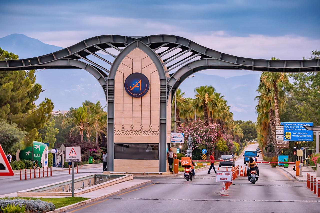 Main entrance gate and roadway leading into Akdeniz University Campus, Antalya, Türkiye, June 28, 2022.  (Photo via Adobe Stock)