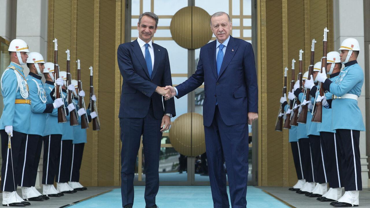 Greek Prime Minister Kyriakos Mitsotakis (L) and President Recep Tayyip Erdogan pose before a meeting in Ankara, May 13, 2024. (Photo by Turkish Presidential Press Service/AFP)