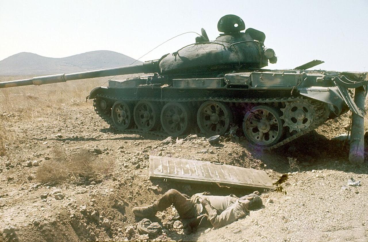 Destroyed Syrian T-62 with Fallen Crew Member Somewhere in the Golan Sector, Yom Kippur War, 8 October 1973. (National Library of Israel)