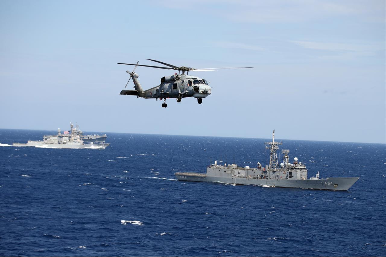 USS Roosevelt (front) and USS Mount Whitney (rear) ships of U.S. Navy,  while a Seahawk helicopter belonging to Turkish Navy lands on deck in Adriatic Sea, Italy, Sept. 24, 2025. (AA Photo)
