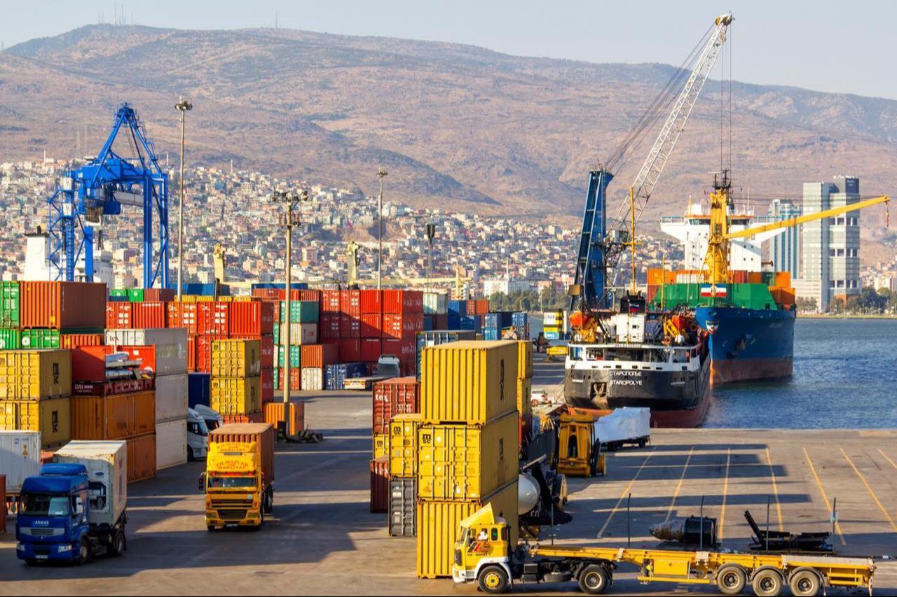 Container ships and trucks operate at Alsancak Port, in Izmir, Türkiye. (Adobe Stock Photo)