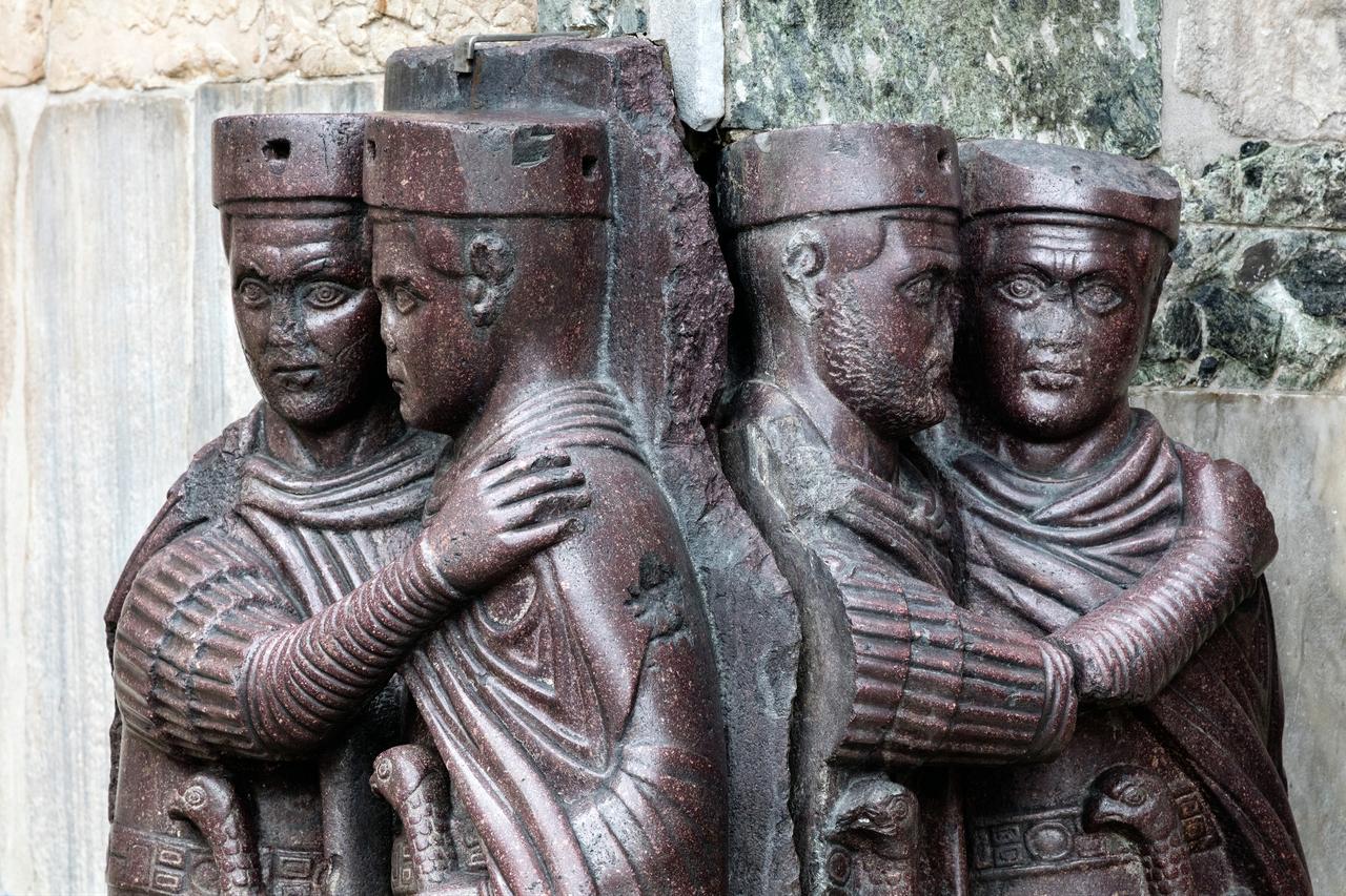 Porphyry sculpture of the Tetrarchs, depicting four Roman emperors embracing in unity, originally from Constantinople, now set in St. Mark’s Basilica, Venice, Italy. (Adobe Stock Photo)