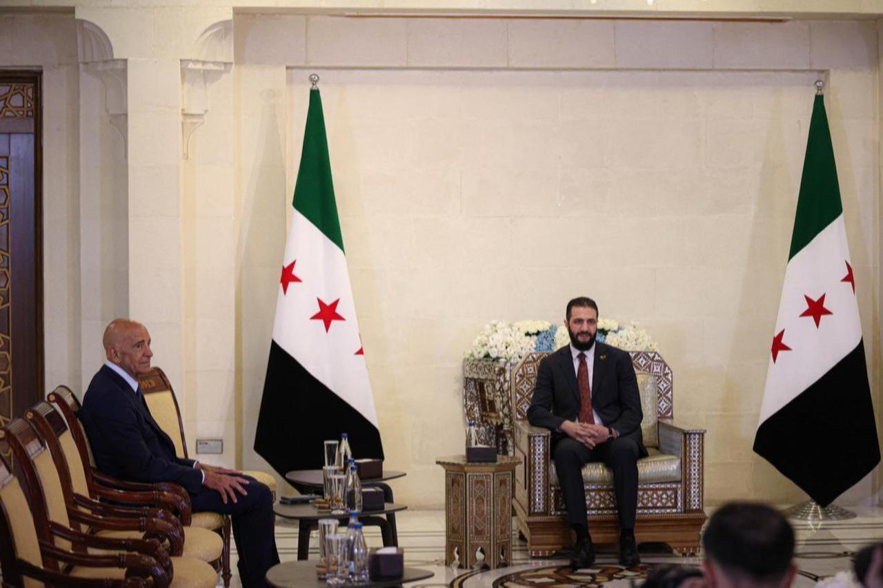 Syrian President Ahmed al-Sharaa (R) welcomes US Ambassador to Ankara and Special Envoy for Syria Tom Barrack (L) and his accompanying delegation at the Peoples Palace in Damascus, Syria on July 9, 2025. (AA Photo)