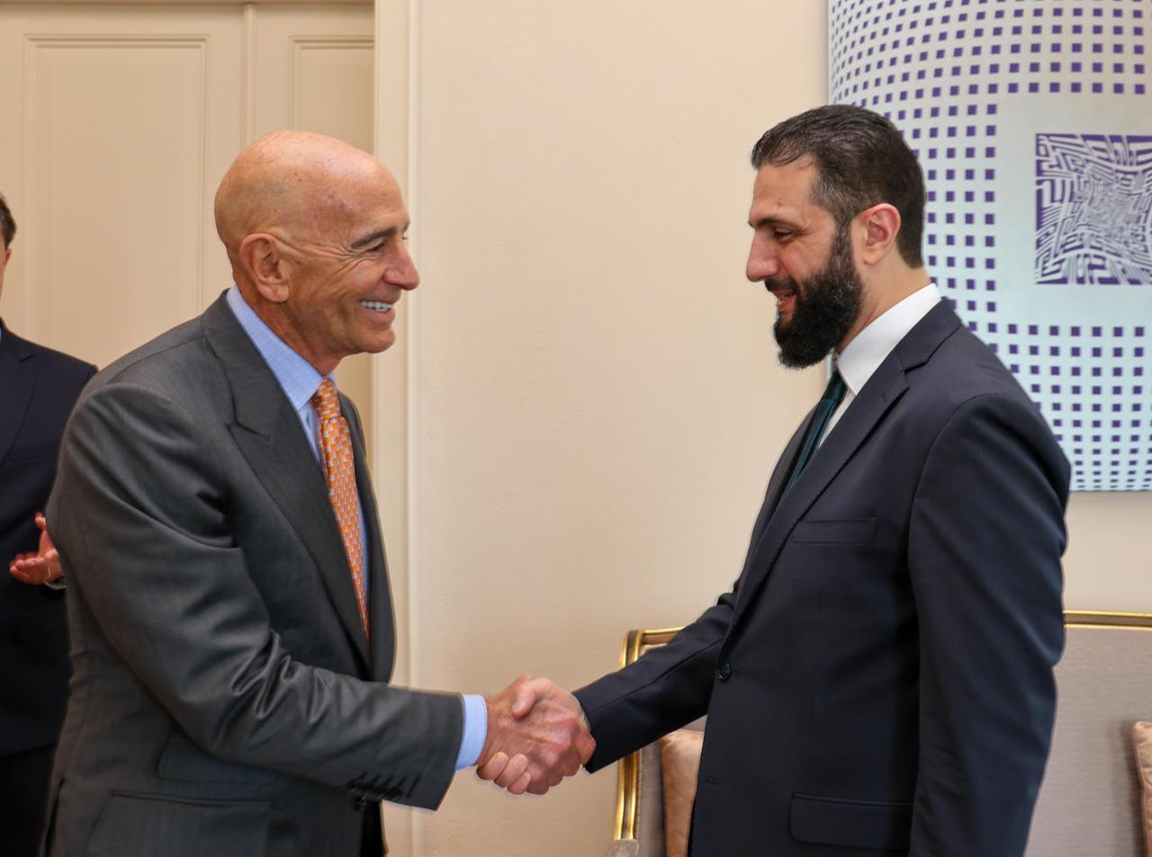 US Ambassador to Türkiye Thomas Barrack (L) shakes hands with Syria's jihadist-turned-interim President Ahmed al-Sharaa (R) during a meeting in Istanbul, Türkiye, May 24, 2025. (Turkish MFA)