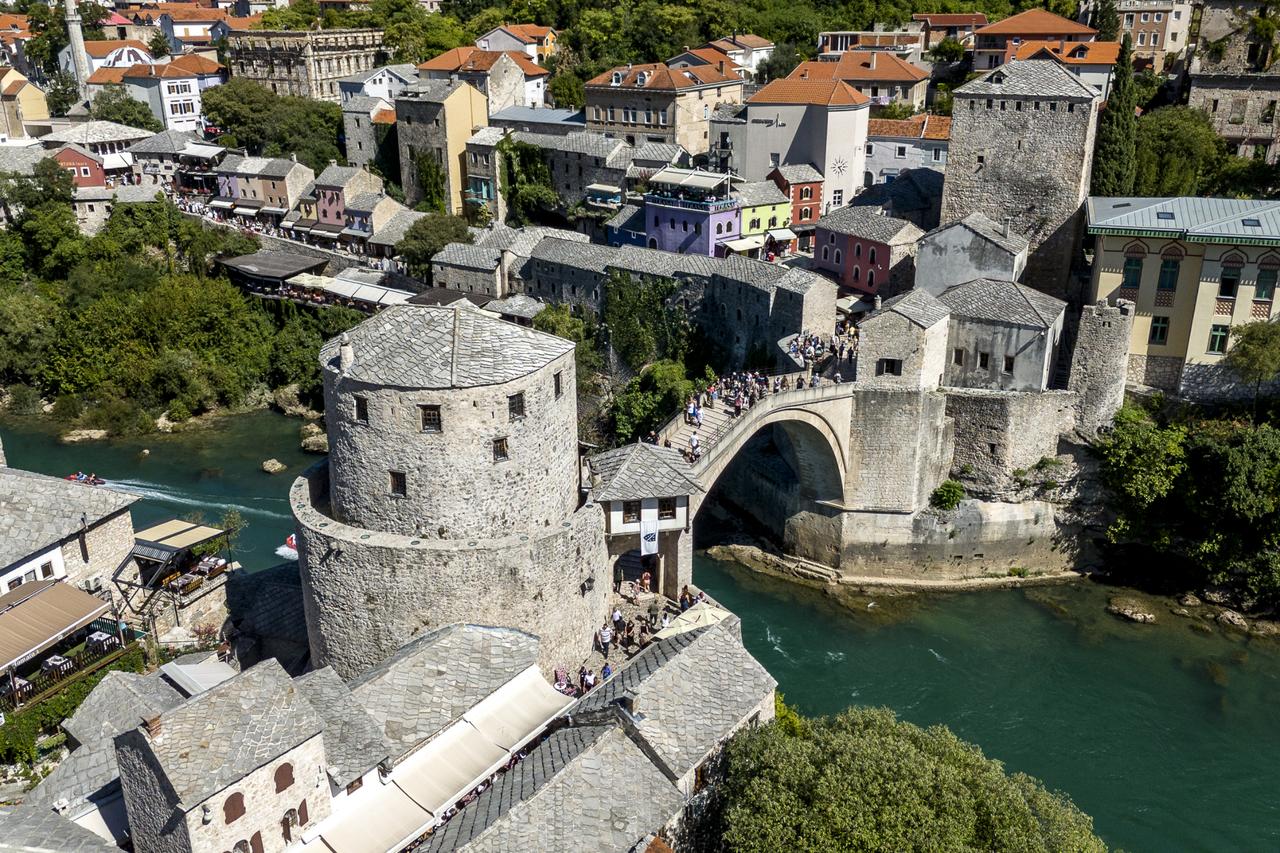 An aerial view of the Mostar Bridge over the Neretva River, uniting both sides of the city and the Bosniaks and Croats for five centuries, preserving Mostars multi-ethnic structure in Bosnia and Herzegovina on Sept. 26, 2025. (AA Photo)