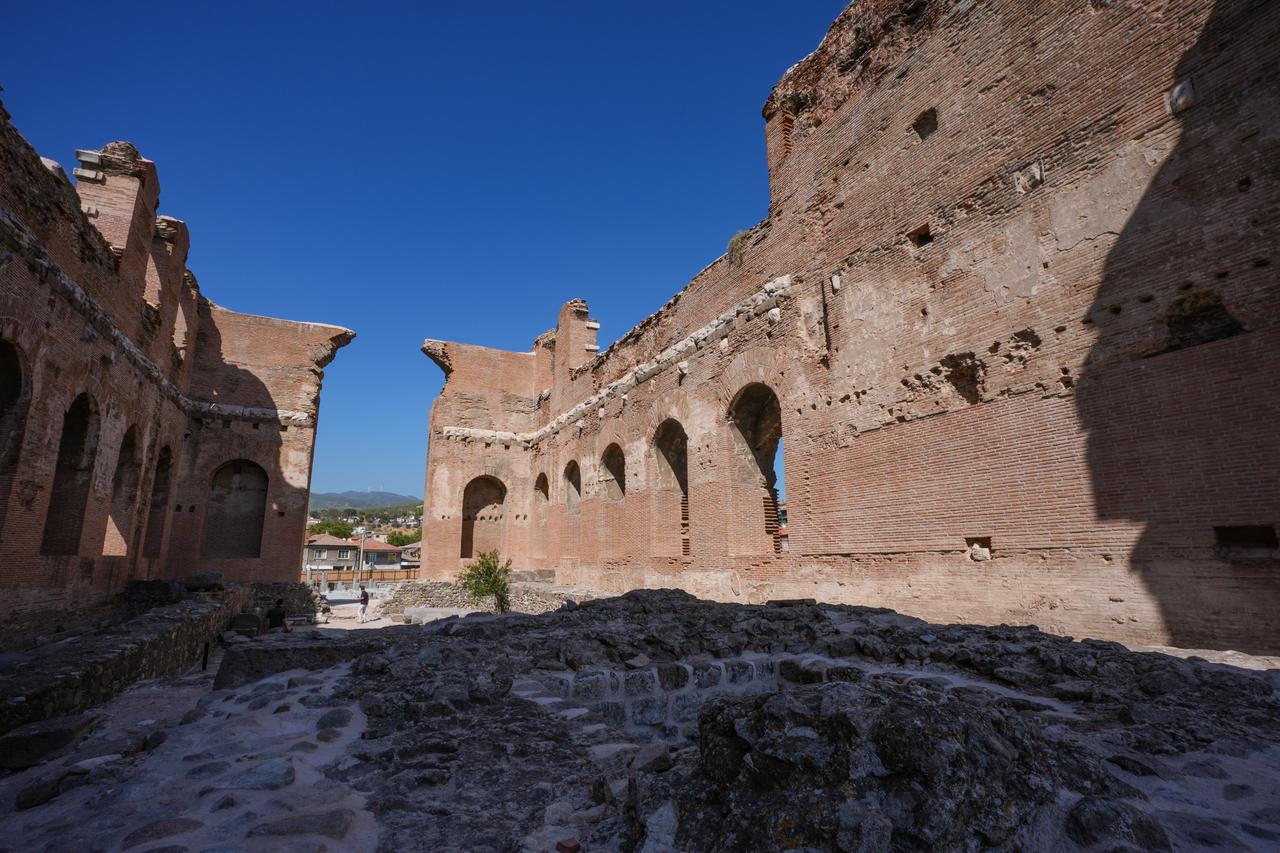 Restoration, conservation, and landscaping works continue at the Red Basilica, a temple named after its distinctive red bricks, located in the ancient city of Pergamon in Izmir’s Bergama district, Türkiye, Sept. 26, 2025. (AA Photo)